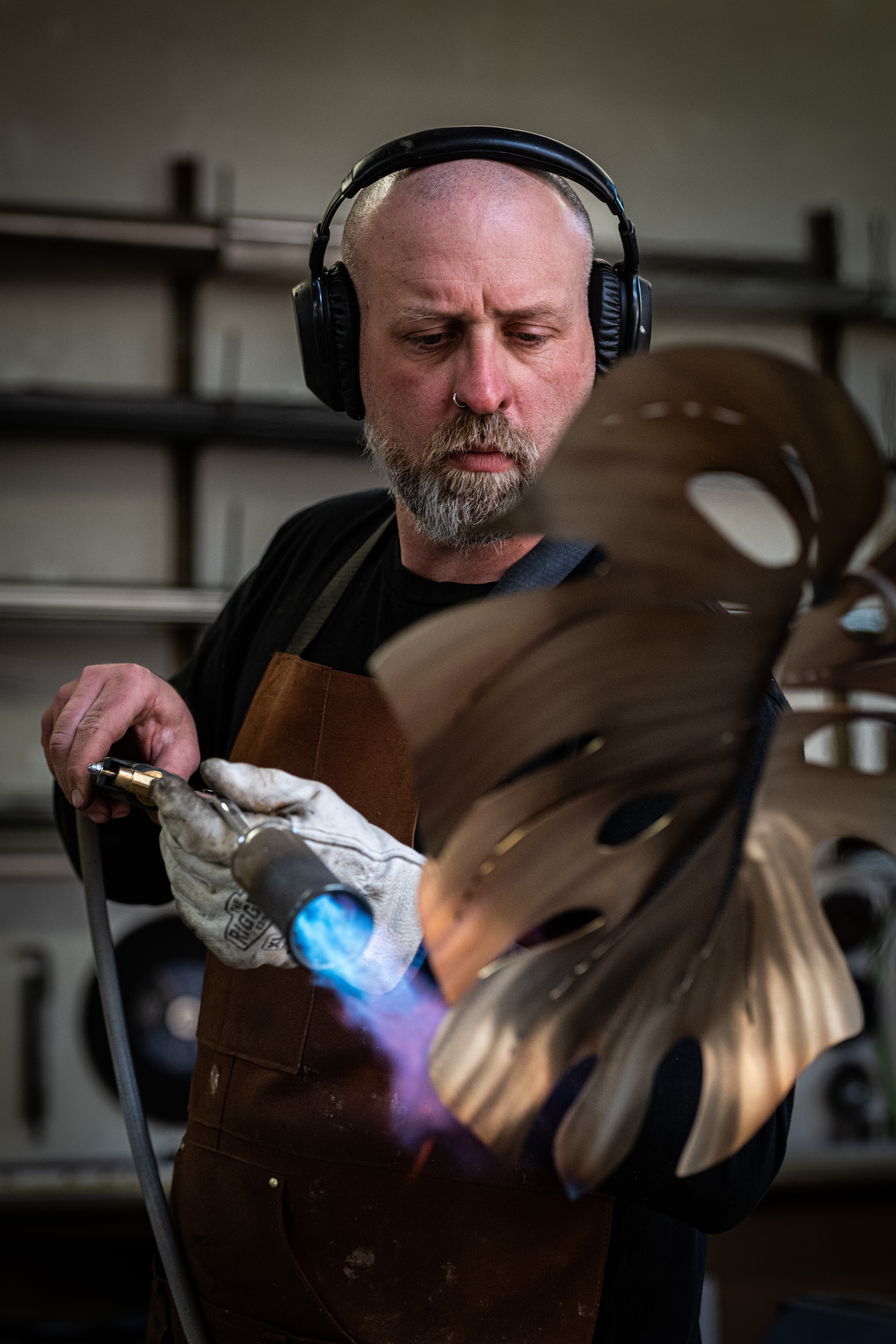 Detail — heat colouring a metal leaf